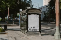 Bus shelter with white background poster displaying Los Angeles branding in clean layout